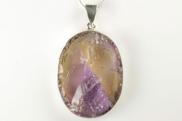 An ametrine pendant showing the amethyst and citrine in the same stone.